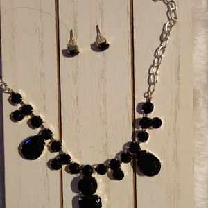 An evening necklace for a holiday and earrings